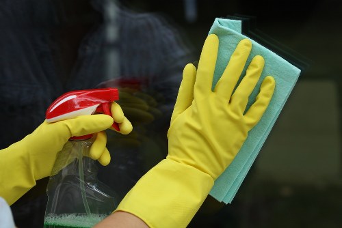 Cleaner carrying out end of tenancy house cleaning with ethical labour standards
