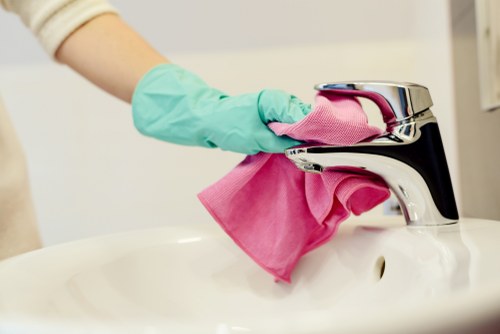 Team completing end of tenancy house cleaning with safe work practices