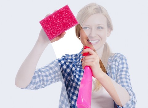 Professional cleaners maintaining a modern office in London